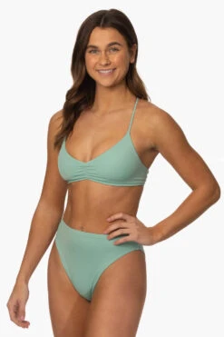 Leandra Bikini Bottom - Newport -Outlet Aqua Surf Wears Store Surf Bottoms Leandra Solid Newport SideFront MiaClark 011623