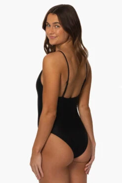 Juana Surf One Piece - Black -Outlet Aqua Surf Wears Store Surf Onesies Juana Solid Black SideBack MiaClark 011623
